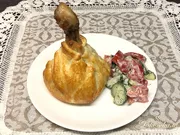 Hähnchenschenkel in einer Tüte